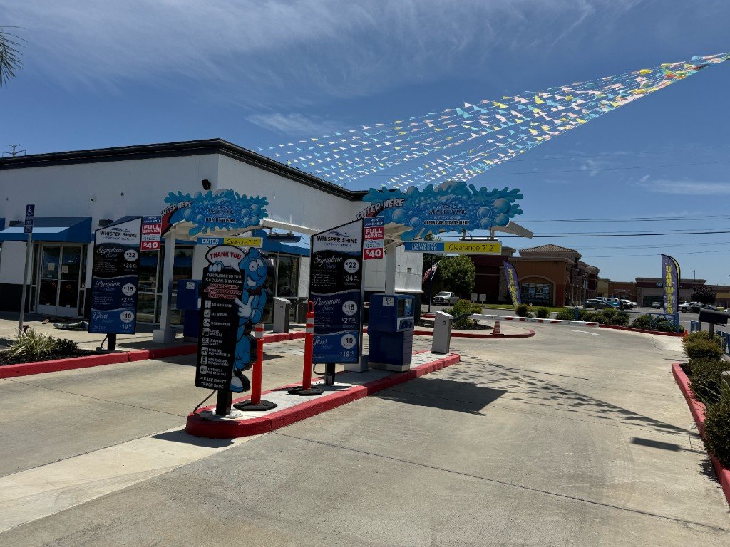 Whisper Shine Express Wash entry lanes with wash package menu boards